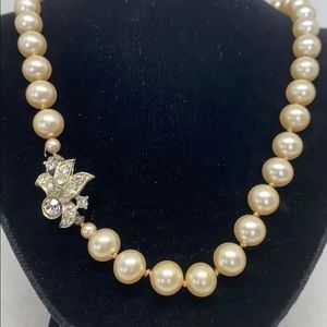 Beautiful 23” strand of hand knotted faux pearls.